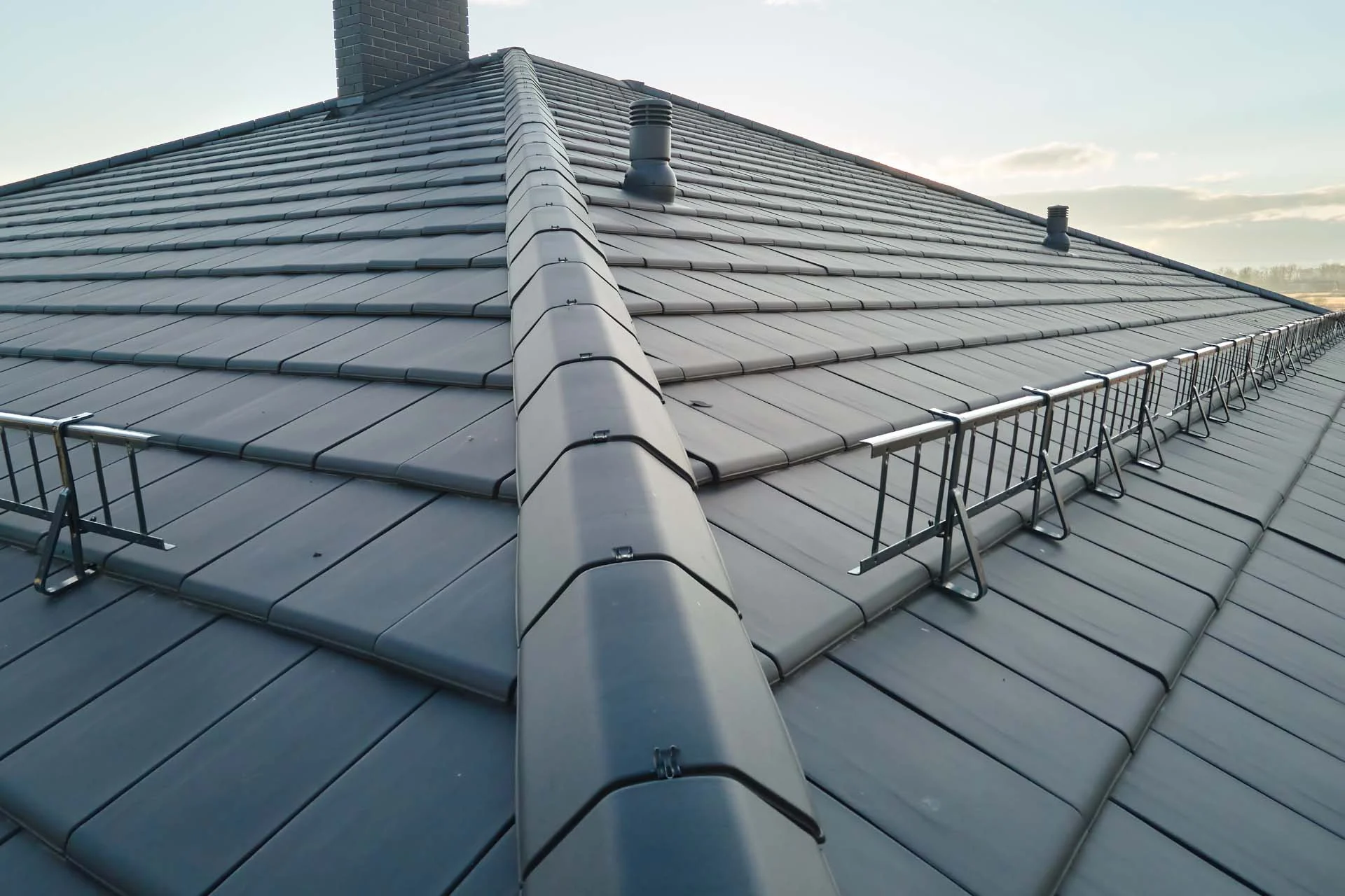 Closeup Of House Roof Top Covered With Ceramic Shi 58HU2T4